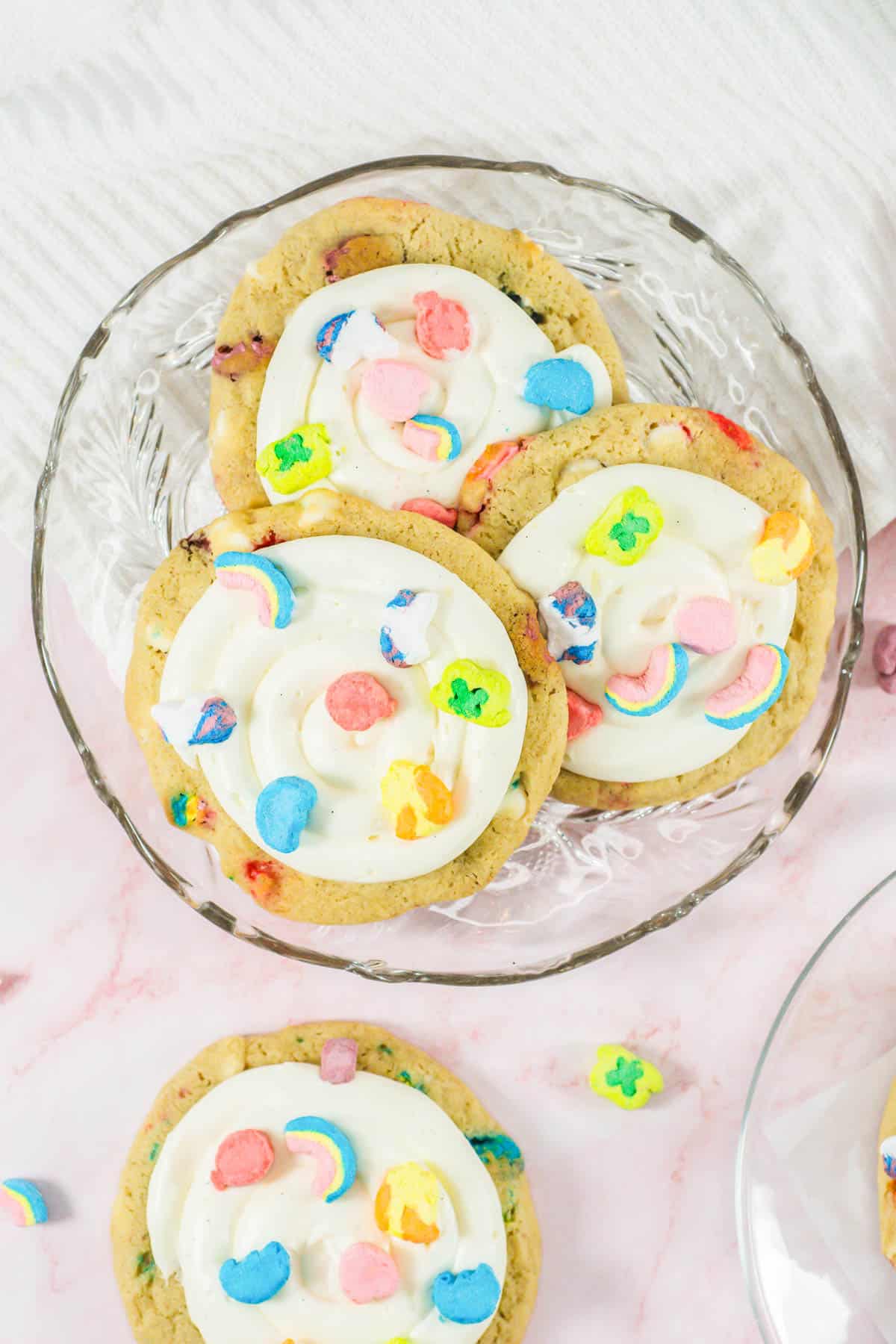 Decorated Lucky Charms Cookies on a glass plate.