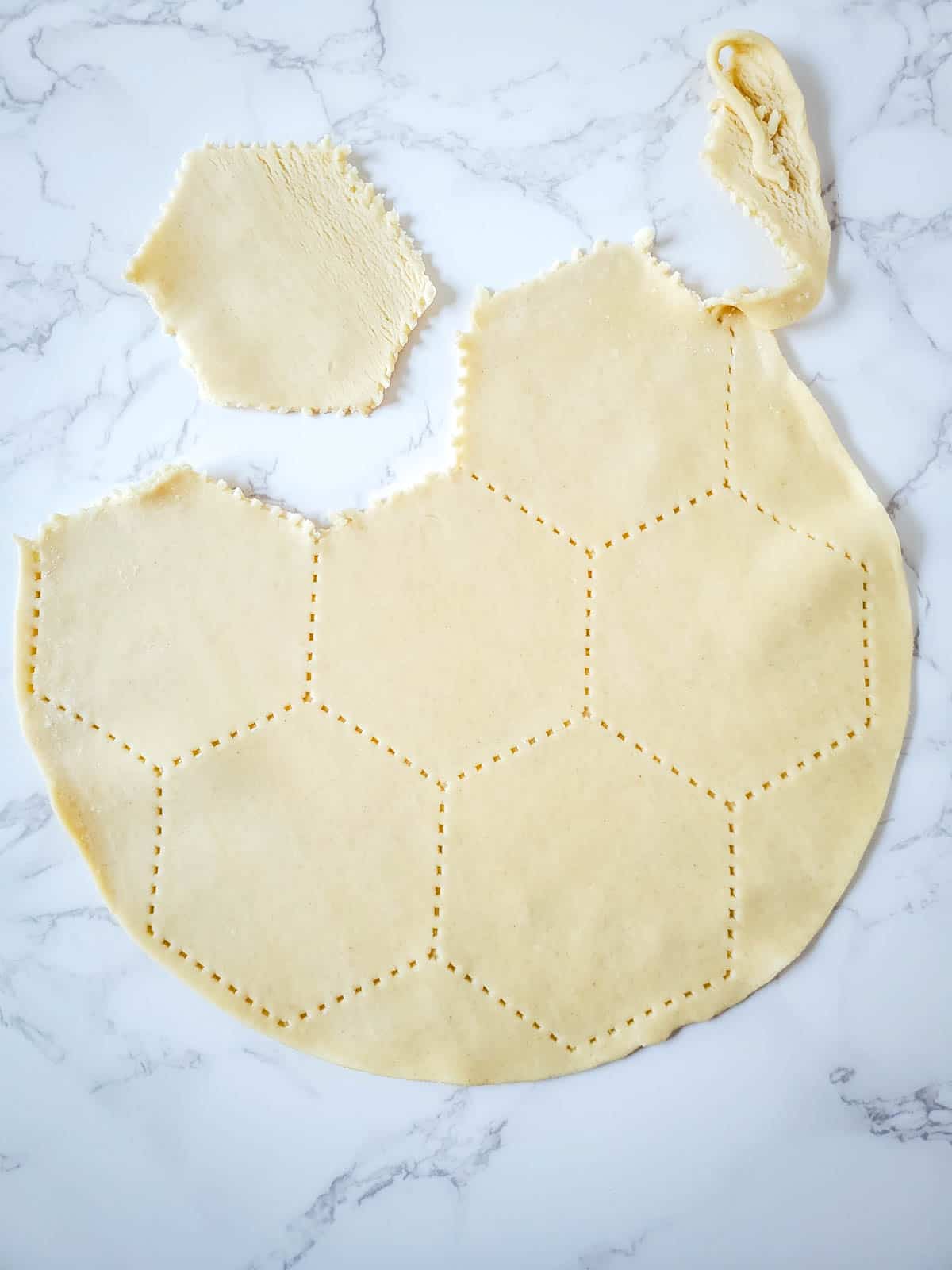 Breaking apart the unrolled pie crusts.