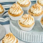 Close up of RumChata Cupcakes on a round metal cake stand.