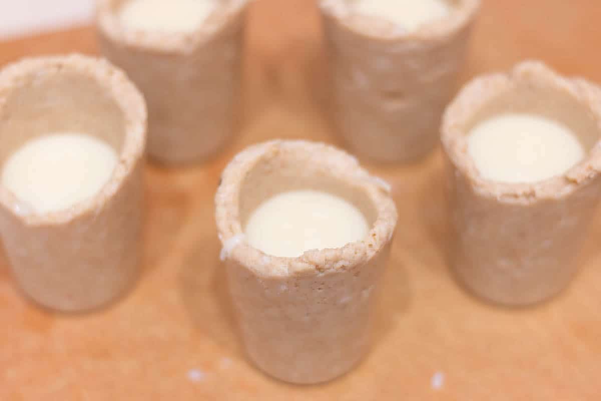 rumchata ganache dessert idea - in process 7 Edible Graham cracker cups filled with RumChata and white chocolate ganache mixture.