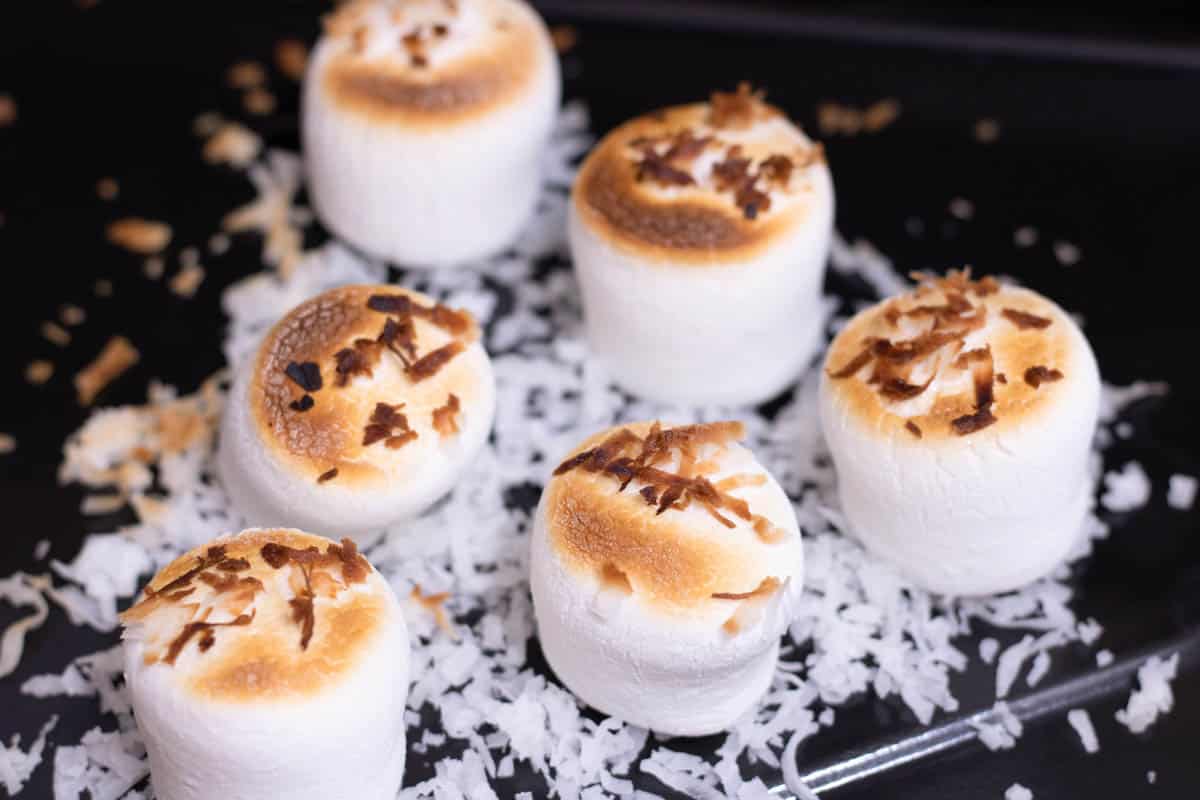 toasted marshmallow topper for cookie cups dessert shot - in process 9 Marshmallows on a baking tray under the broiler and lighted toasted on the top.