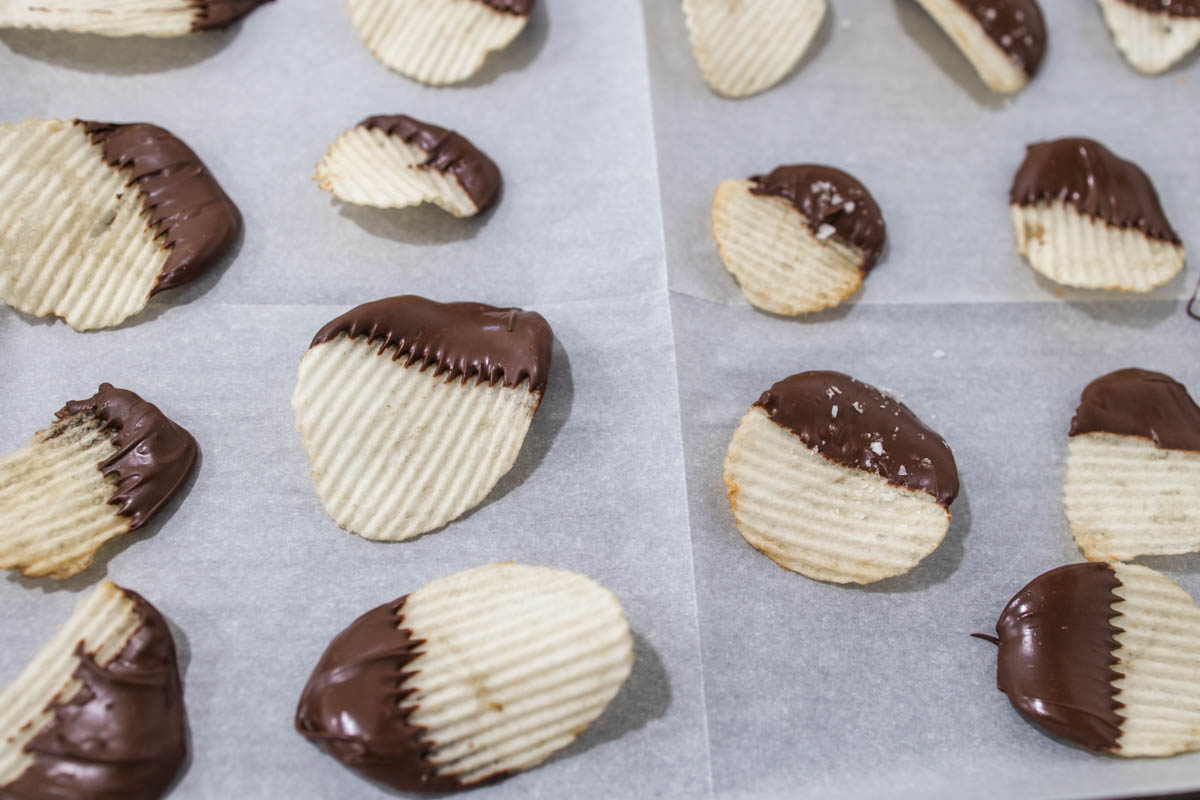 Chocolate dipped potato chips Chocolate dipped potato chips on a cookie sheet setting up.