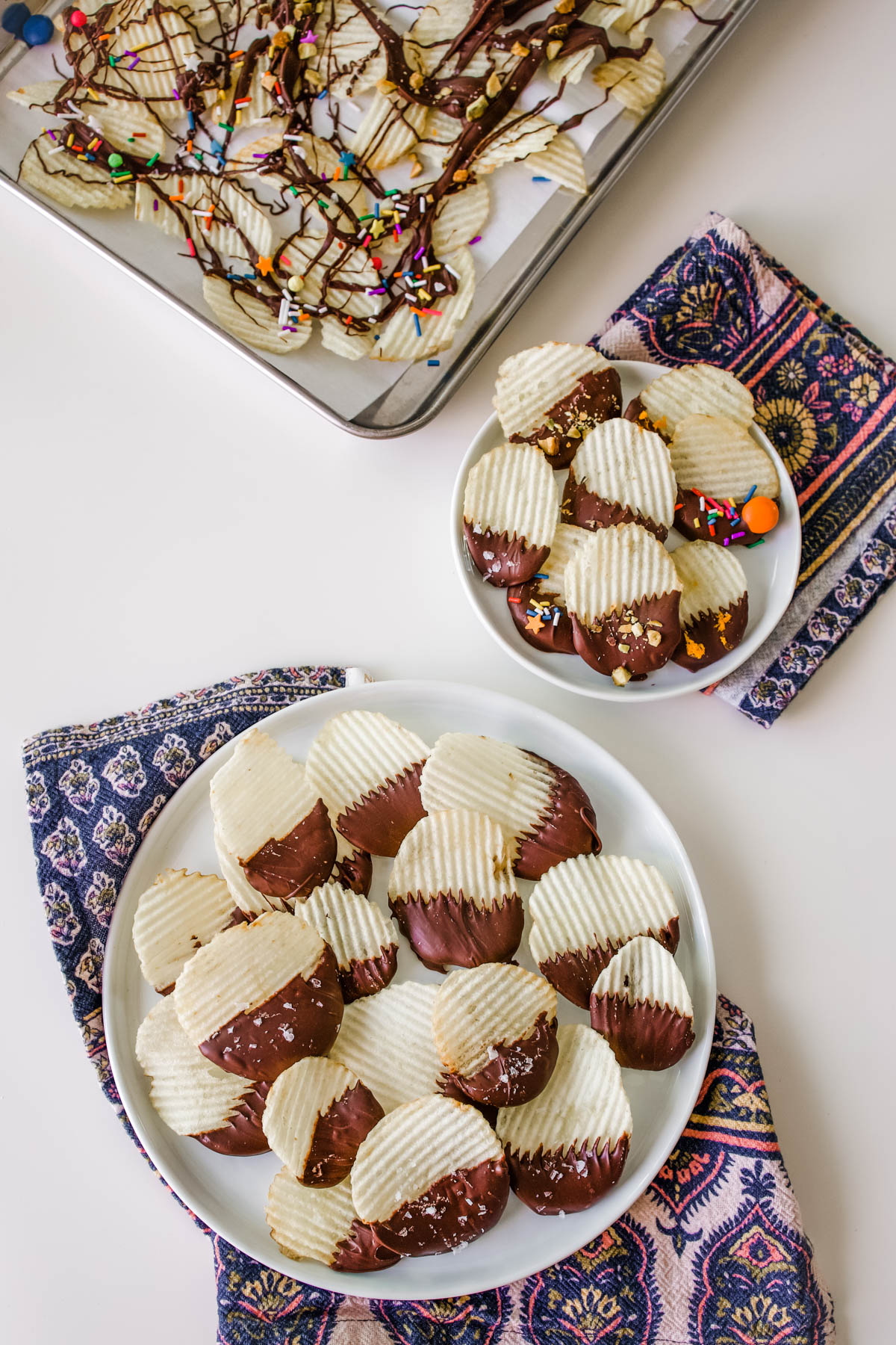 Chocolate covered potato chips Chocolate covered potato chips made 3 ways on a white table.